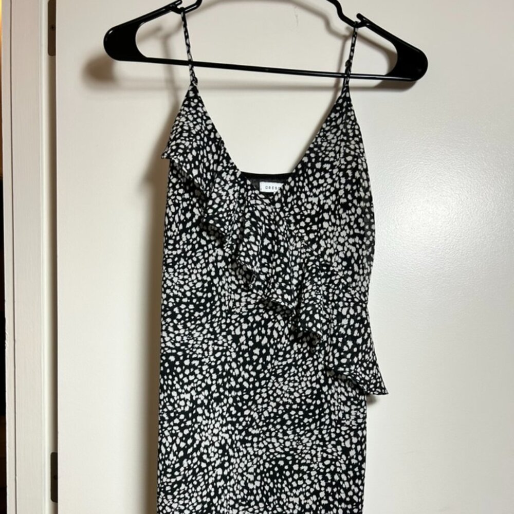 black and white dress with a ruffle across the front